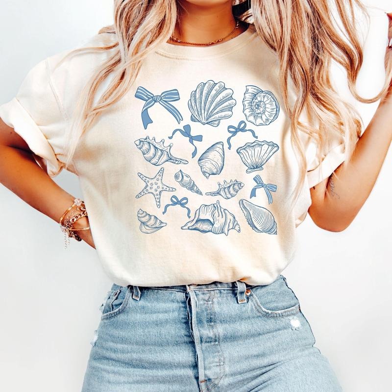 Comfort Colors SeaShell T-Shirt, Retro Summer Tee, Beach Coquette Bow Shirt, Coquette SeaShell Shirt Cotton Fabric...