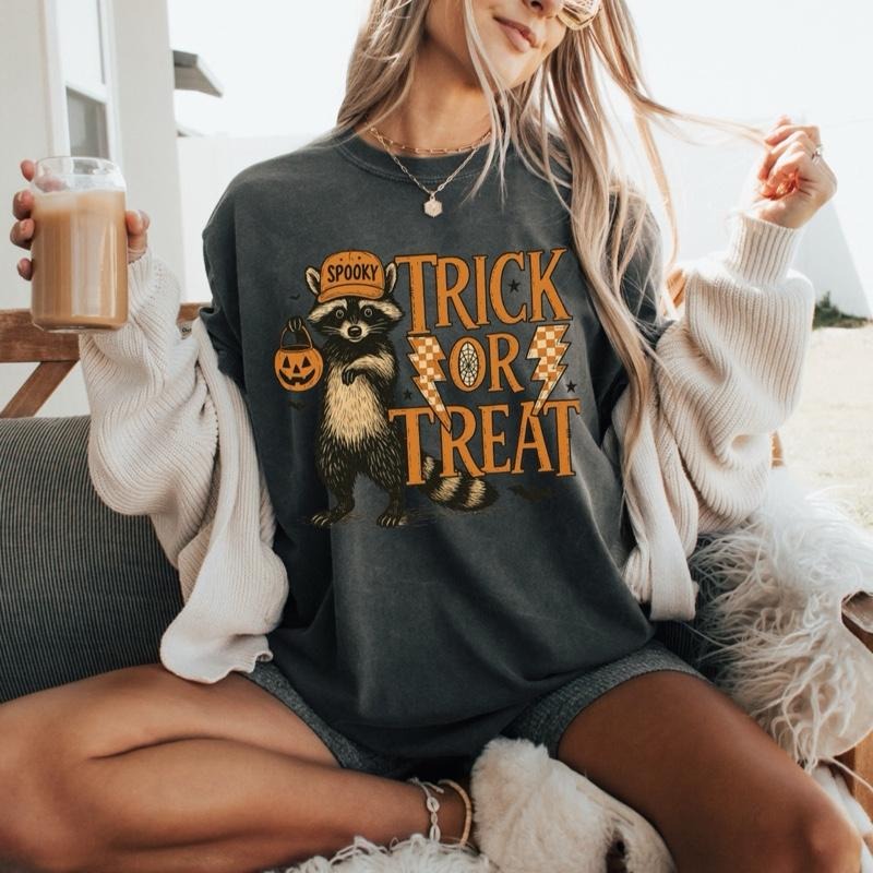 Comfort Colors Trick or Treat Funny Racoon Short Sleeve Casual Cotton Graphic Tshirt for Women Halloween Design Hoodie,...