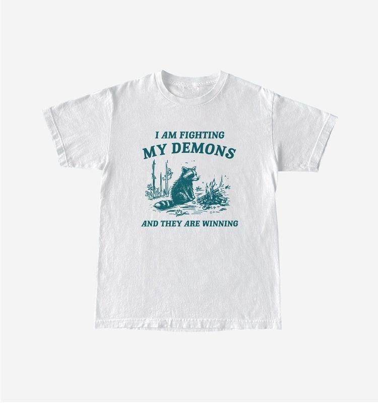 Funny Meme Shirt, I Am Fighting My Demons Tee, Raccoon Gift Unisex T-Shirt Hoodie, Sweatshirt | GrindPrints.com