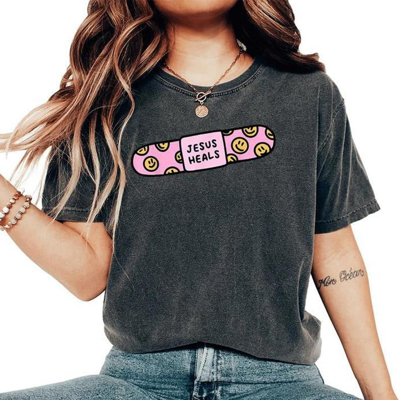Jesus Heals Band-Aid Christian Faith Healing Bible Verse Women's Oversized T-Shirt, unisex shirt, crewneck menswear...