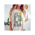 Life Is Better At The Beach T-shirt Comfort Colors Playful Design Top Summer Coastal Style Palm Tree Sun Graphic Top...