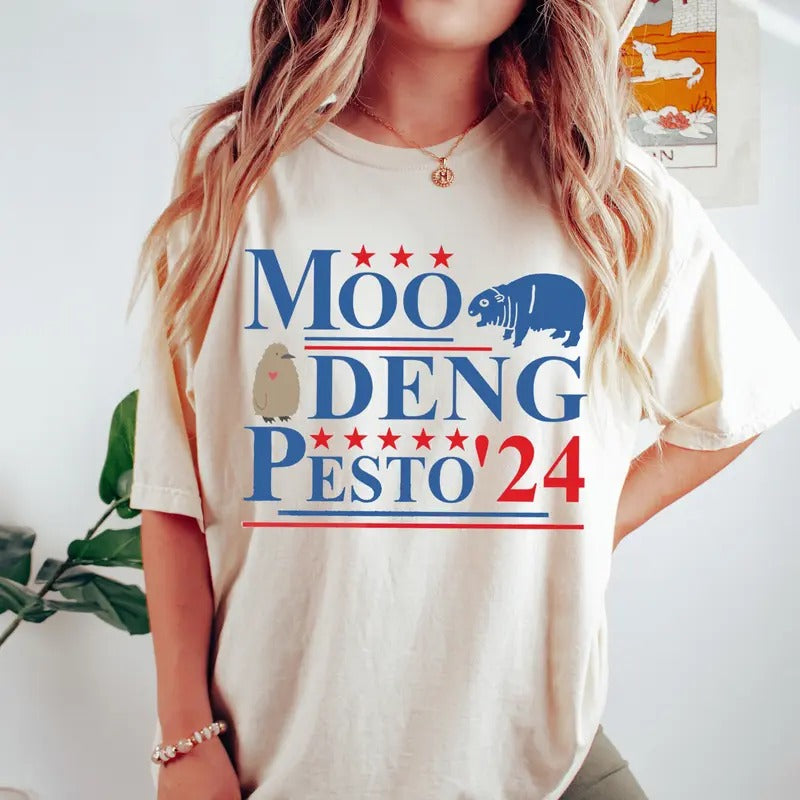 Moo Deng Pesto 2024 T Shirt, Funny Moo Deng Shirt, Baby Pesto Penguin Tshirt Hoodie, Sweatshirt | GrindPrints.com