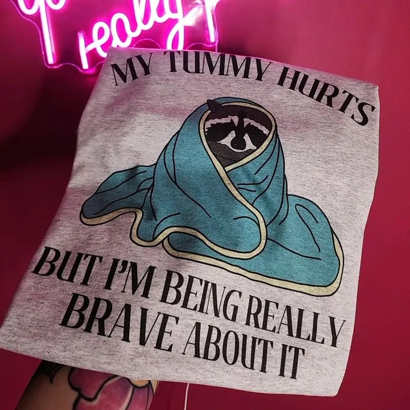 My tummy hurts but I'm being really brave about it Graphic Tee Hoodie, Sweatshirt | GrindPrints.com