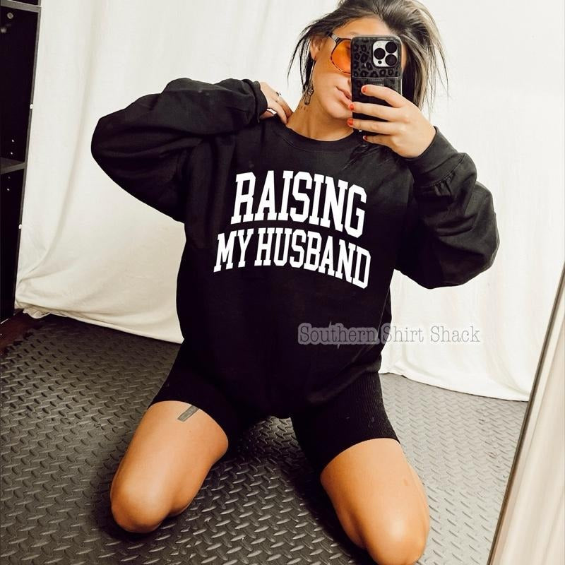 Raising my Husband Sweatshirt | Black Sweatshirt graphic shirt unisex style Hoodie | GrindPrints.com