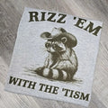 Rizz' em with the tism Graphic Tee or Sweatshirt Hoodie | GrindPrints.com