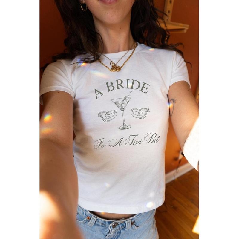 [Sale Up To 20%] A Bride In A Tini Bit Baby Tee, Dirty Martini Themed Bachelorette Party Dirty Martini Bride Baby Tee...