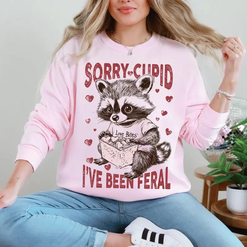 Sorry Cupid I'Ve Been Feral Racoon Love Bites Love Crew Neck Love Heart Cupid T-Shirts, Hoodie, Sweatshirt