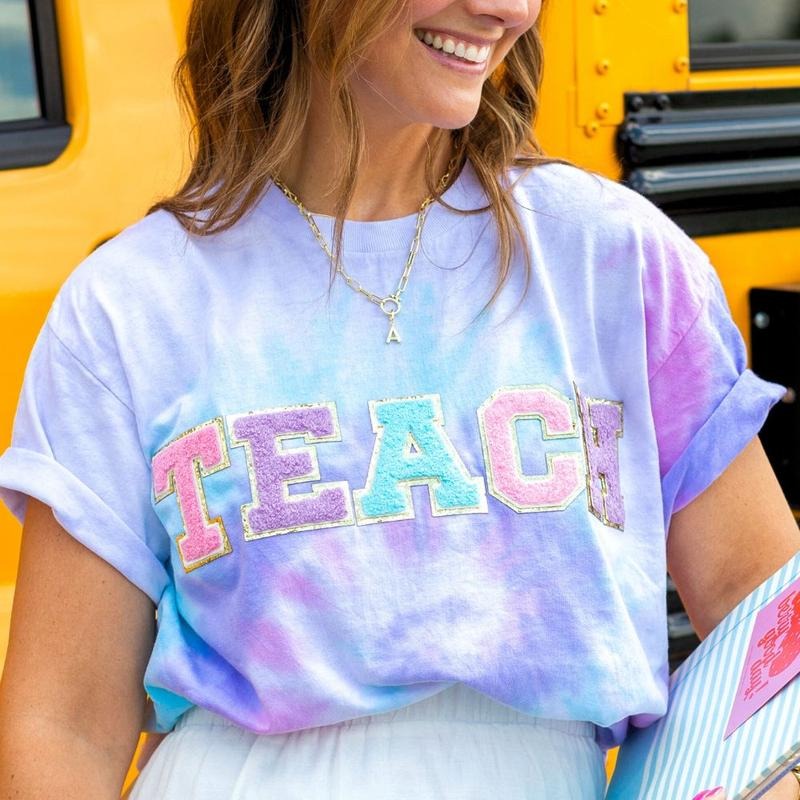 'Teach In Technicolor' Tie Dye Letter Patch T-Shirt Hoodie, Sweatshirt | GrindPrints.com